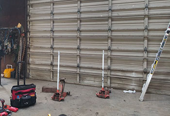 Technician’s tools and inspection equipment laid out for commercial garage door maintenance at a La Presa, CA business.