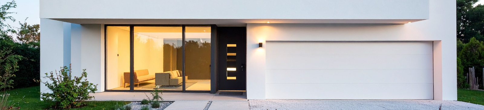 Modern home with garage door at dusk in Chula Vista